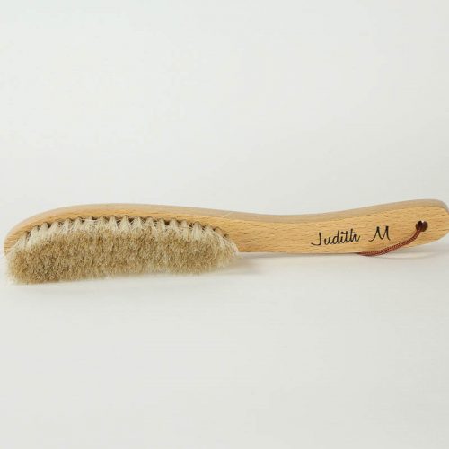 Soft Bristled brush with handle for use on brim or crown of hats.