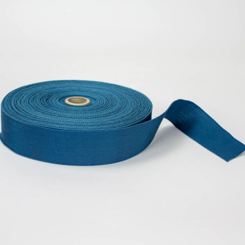 Teal Blue. Made in France. Blend of 44% rayon/ 56% cotton grosgrain belting with a saw-tooth edge.