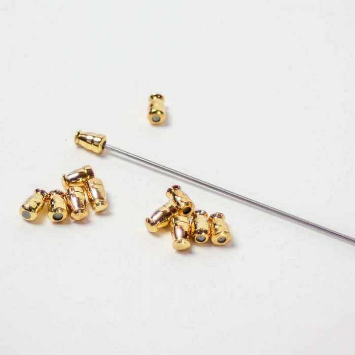 Gold Small metal nibs with rubberized insert to cover sharp end of hatpin, assorted shapes.
