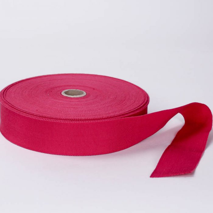 Hot Pink. Made in France. Blend of 44% rayon/ 56% cotton grosgrain belting with a saw-tooth edge.