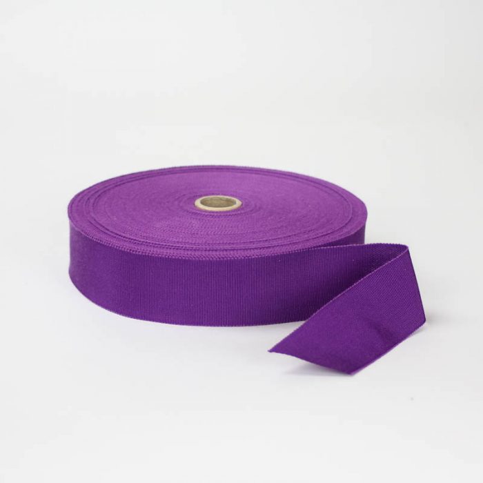 Red Violet. Made in France. Blend of 44% rayon/ 56% cotton grosgrain belting with a saw-tooth edge.