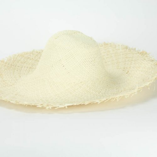 An off-white bleached flat weave raffia hatbody with raw edge,