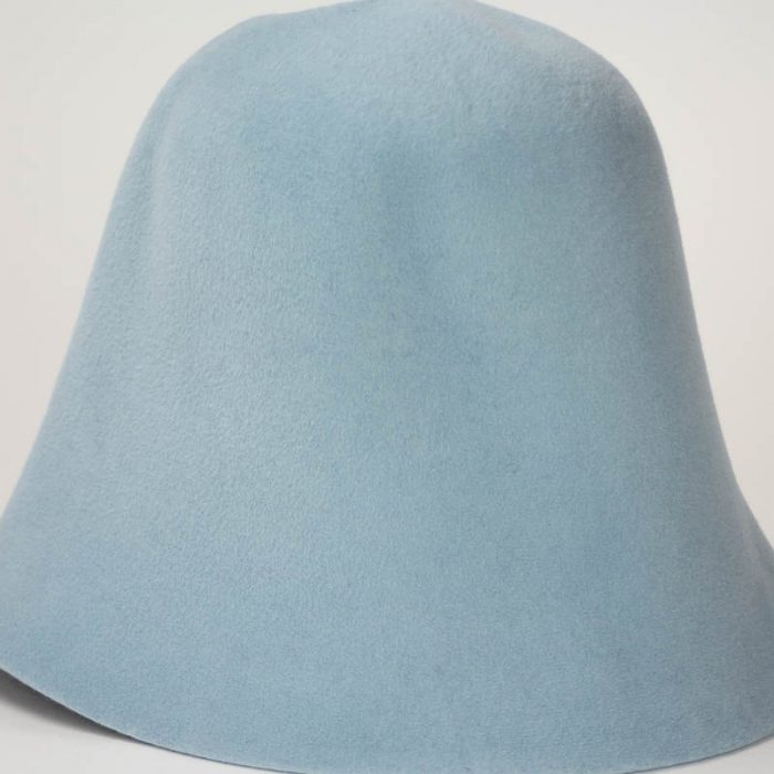 A pastel blue hood, or cone shape, with velour finish on outside only.