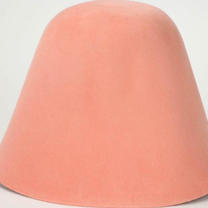 Apricot hood, or cone shape, with velour finish on outside only.