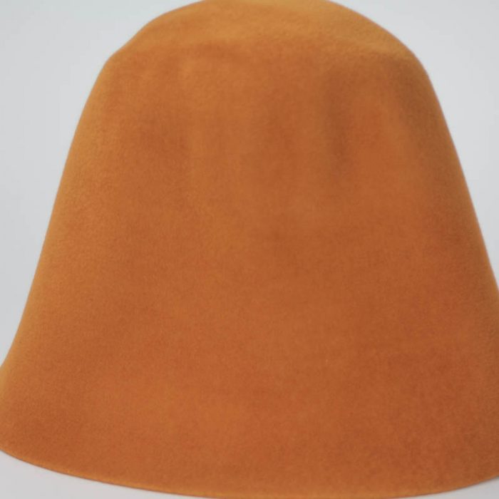 Pumpkin shell shade hood, or cone shape, with velour finish on outside only.