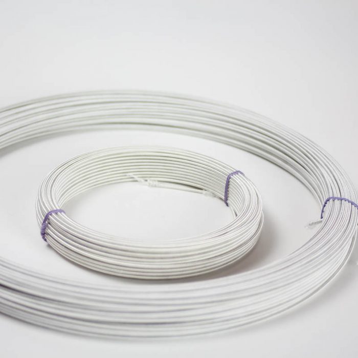 Rayon covered wire in white, #18 (.91 mm) is the most popular gauge. Used mostly in reinforcing hat brims and creating shapes and frames.