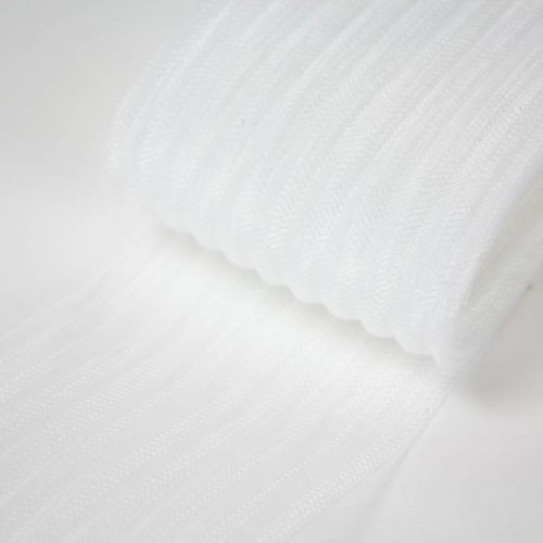White pleated horsehair with 1/4 inch pleating running through, parallel to length.