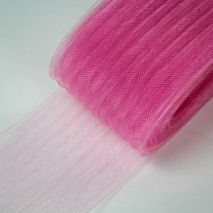 Pink pleated horsehair with 1/4 inch pleating running through, parallel to length.