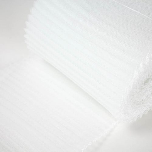 White polyester, very flexible, 1/4 inch pleats.