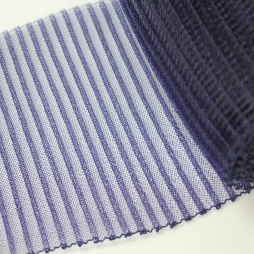 Navy blue polyester, very flexible, 1/4 inch pleats.