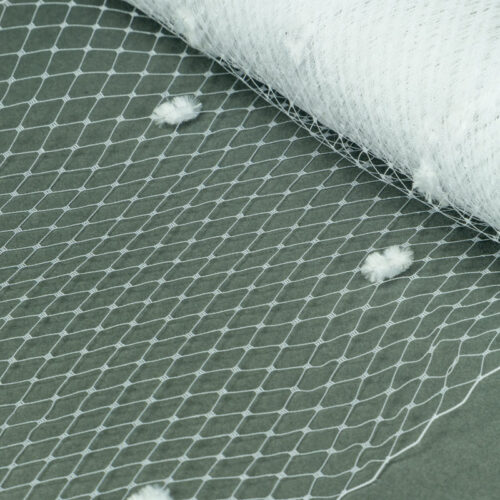White Standard diamond pattern with 1/4 inch opening, 8-9 inch width and 1/4 inch chenille dots, 100% nylon.