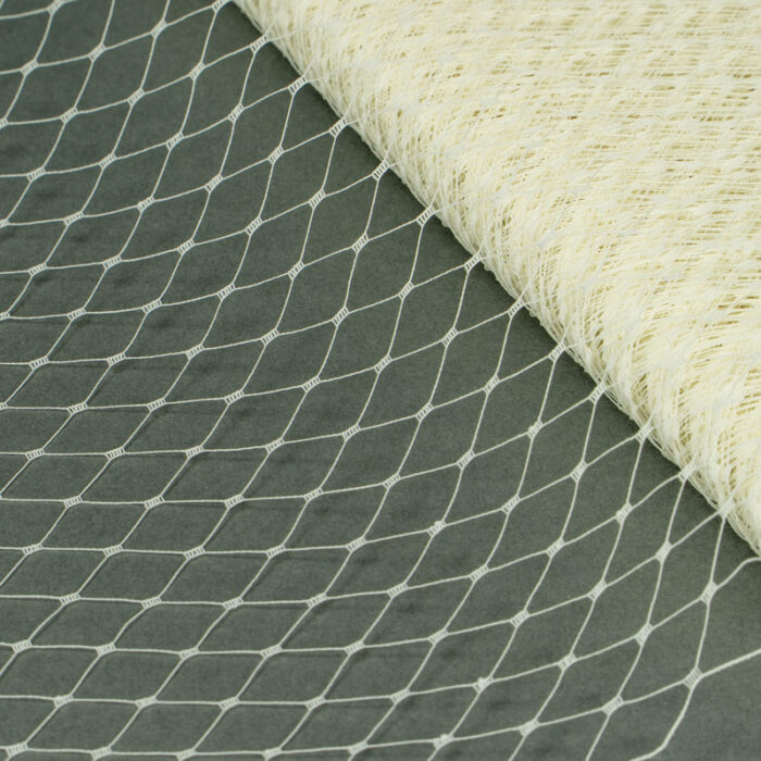 Ivory Merry Widow pattern with 1/2 inch diamond opening, 12 inch width, 100% nylon.